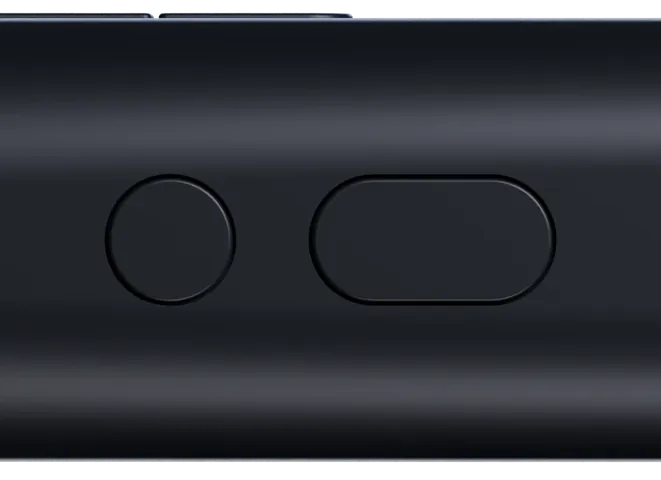 The AI button and the round button on the side of a matte black Nexus Pen lying on its side.